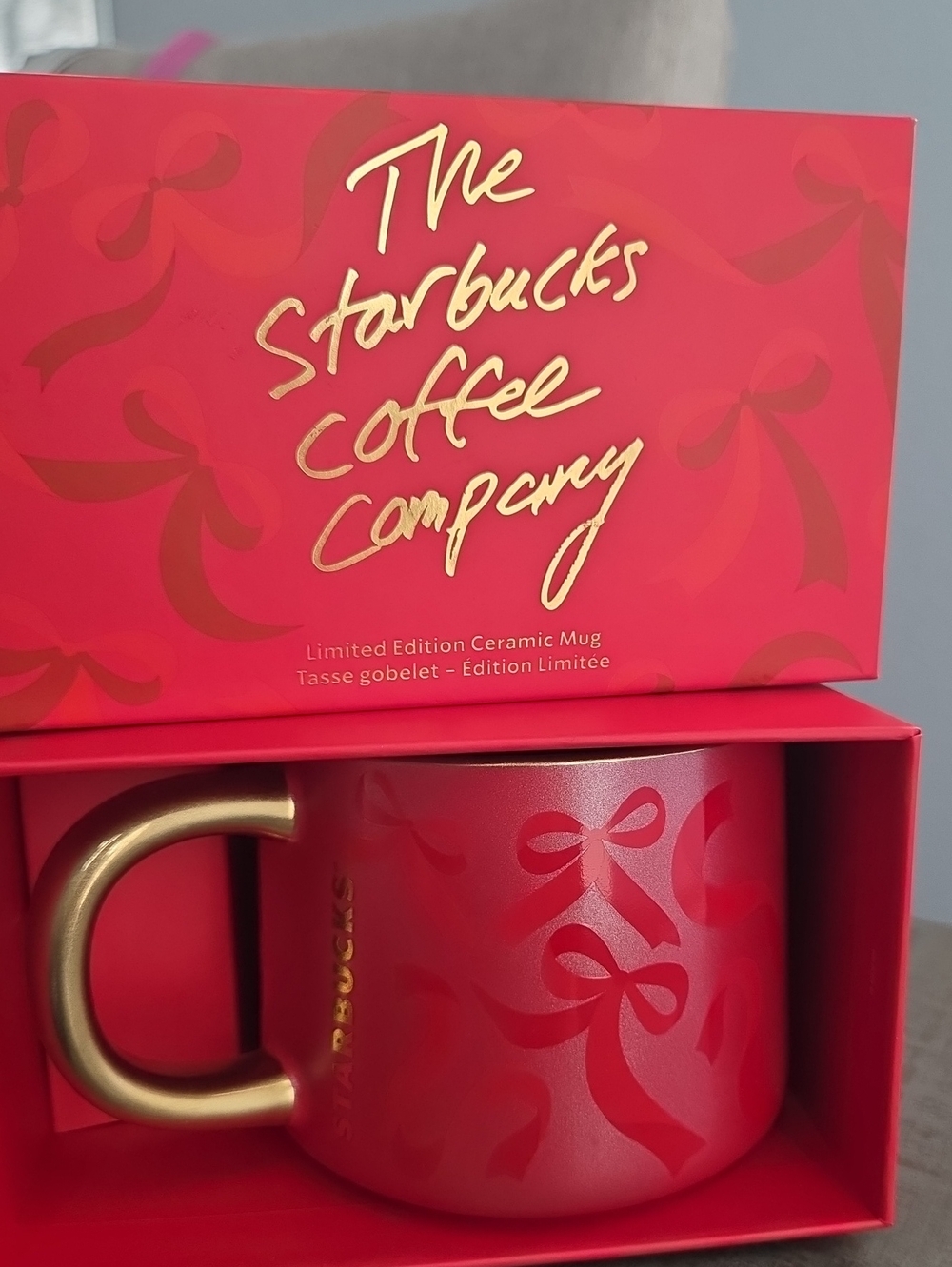 Starbucks Red Ceramic Mug with Gold Handle and Ribbon Motif